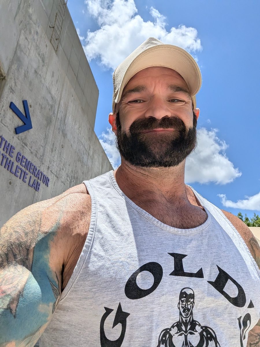 Coach Joe smiling outside the gym
